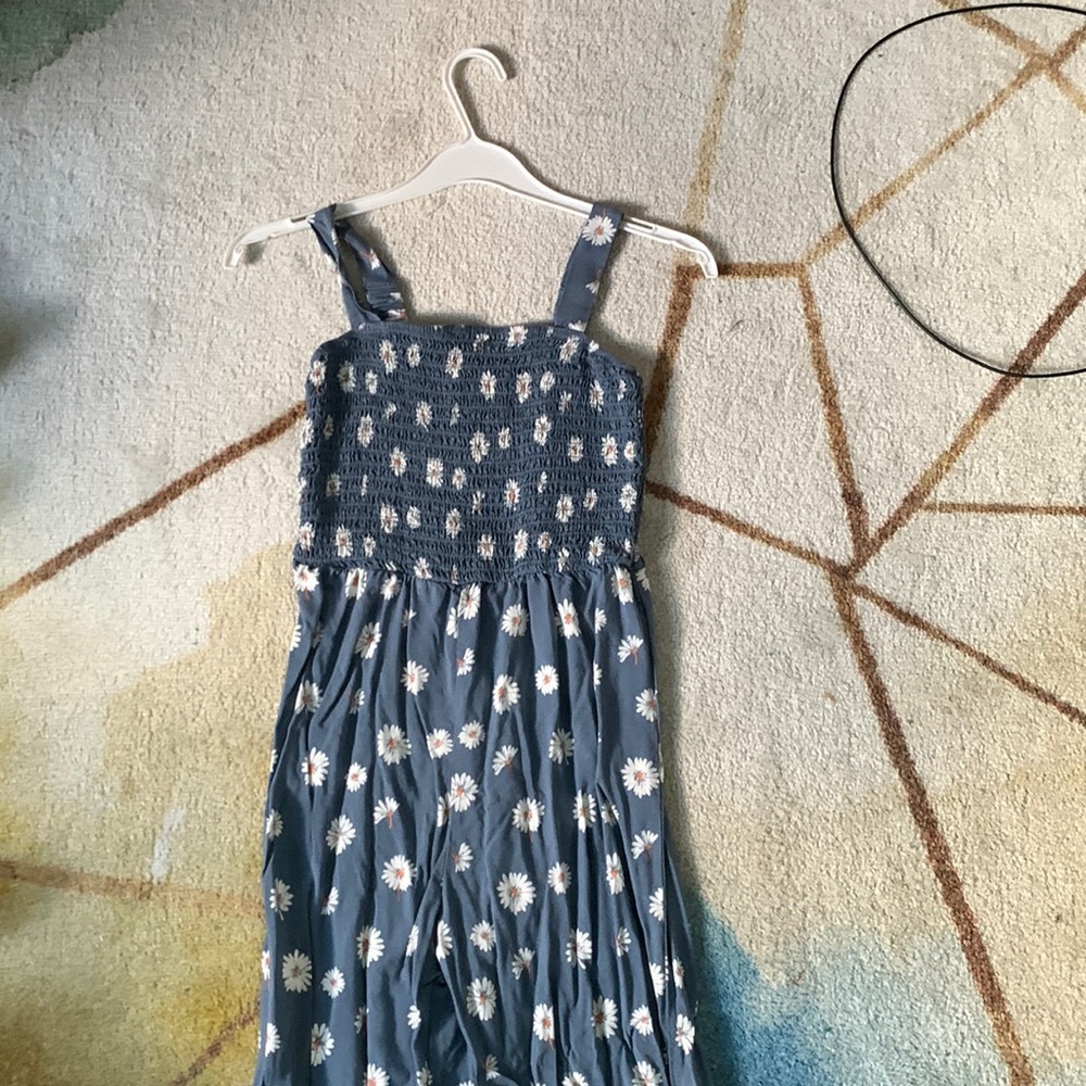 Blue with white flowers jumpsuit, slight flare at the bottom, cinched top